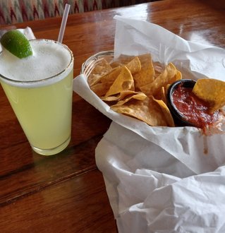 Here is a view of part of the dining room at PAPA FELIPES. My appetizer of Guacamole, the chips and salsa, and the Margarita have already arrived. These are all traditional to New Mexican cuisine and many New Mexican restaurans will give a free basket of chips with salsa automatically.