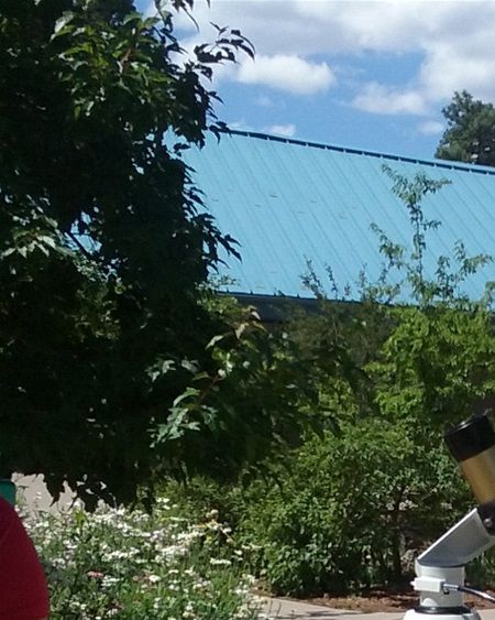At Lowell Observatory, we were able to look at the sun through this telescope which had a filter that made the sun dark red. We also went on a tour of the grounds. A lecture in the library, which was the working library used when Pluto was first sited, started the tour.