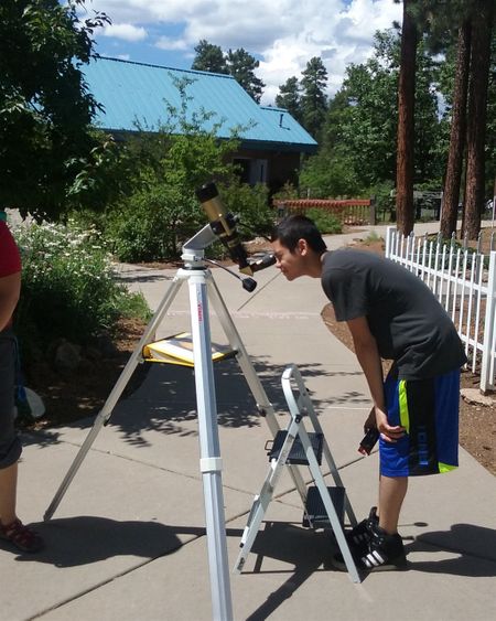 At Lowell Observatory, we were able to look at the sun through this telescope which had a filter that made the sun dark red. We also went on a tour of the grounds. A lecture in the library, which was the working library used when Pluto was first sited, started the tour.