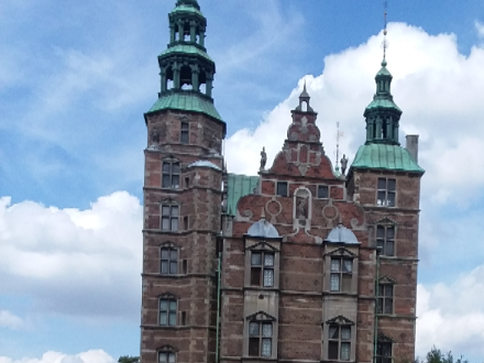 Farida can be seen here in a colorful dress on the grounds of the very colorful Rosenborg Castle which is in central Copenhagen. The correct metro station to get off at is Nørreport. Then take a short walk past the botanical gardens to reach Rosenborg castle. The walk is only about 10 minutes and the neighborhood is lovely.