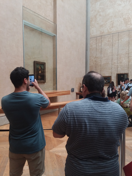 I like taking photos of people who are taking photos of the Mona Lisa. Rayhend is here at the left, doing just that . We are in the Italian renaissance room.