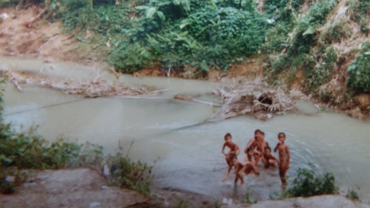 AT THE RIVER THAT BORDERS THE SOUTH SIDE OF OUR NEIGHBORHOOD IN MEDAN