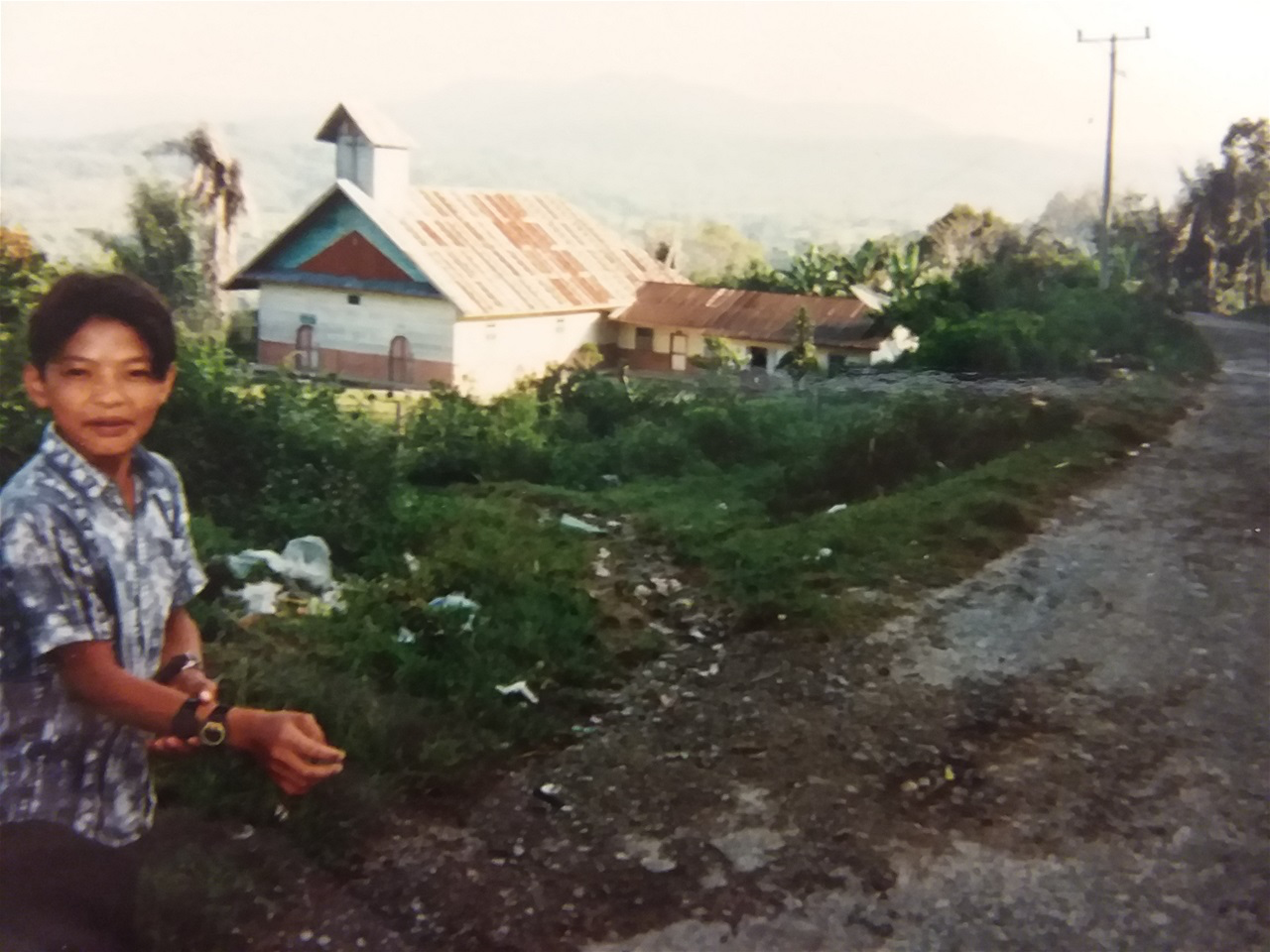 EDO, FARIDAS' YOUNGEST SIBLING, NEAR THE CHURCH WHERE WE GOT MARRIED.