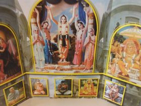 A photo of a mantle or traveling altarpiece. The center shows the Panch-Tattva. Sri Chaitanya Mahaprabu is in the center of the panch-Tattva. Srila Prabhupad is at the lower left corner position. His spiritual master is at his right side. To the right of Srila Prabhupads' spiritual master is HIS spiritual master and so on... This is the sisila parampara of the spiritual masters that descends from Lord Chaitanya Mahaprabu to Srila Prabhupad.