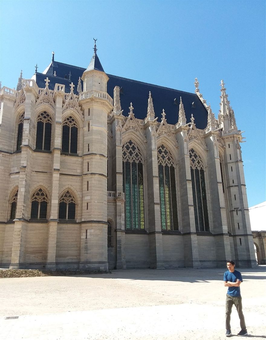 Taking a photo with Reno. The Royal Chapel is behind him. This is the only building that requires an extra entrance fee at Château de Vincennes and the fee is very small. We did not hesitate to get the tickets and we are quite miserly.