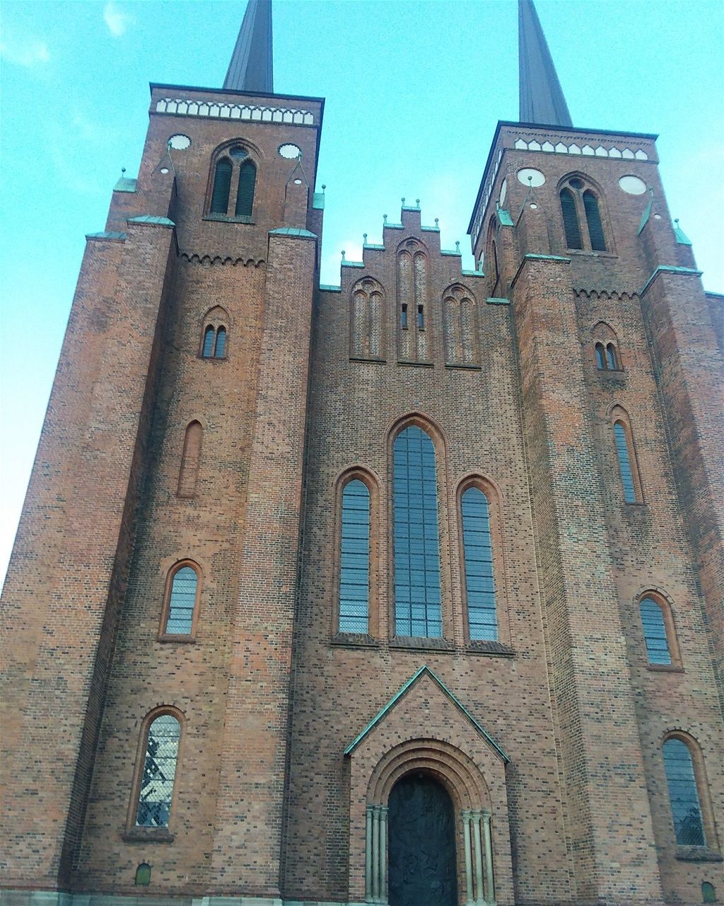The facade of Roskilde Cathedral. The Kingdom of Danmark was founded in Roskilde. Roskilde was the capital of Danmark from 1150-1443. There are 39 royal tombs in this cathedral. It is still the burial site of Danish monarchs. It is a World Heritage Site. .