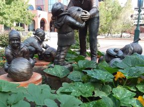 This sculpture is outside of the Pioneers Museum of Colorado Springs. It depicts a farmer who lived in Security which is a southern suburb of Springs. During his lifetime, he gave away hundreds of thousands of pumpkins to the children. His name was Domenico Venitucci,  also known as The Pumpkin Farmer. .
