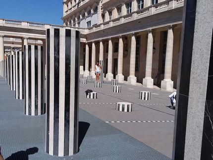 My page called Travel Photos has a couple of photos of the Domaine National du Palais-Royal. This photo has some of the famous stripe columns of Daniel Buren which are in the courtyard. There are about 260 columns of various heights. The Palace itself was constructed between 1633 and 1639. These columns were added to the courtyard in 1986.