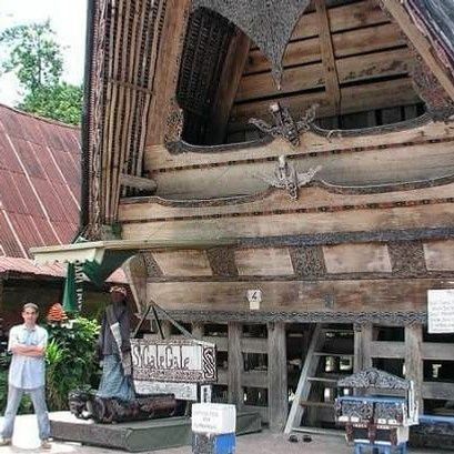 A rumah adat is a traditional style home of the Indonesian people of Sumatra. The one I am standing in front of is on Samosir Island in Tuk Tuk. I am standing next to Si Gale Gale which is a life sized puppet that dances to traditional Batak music.