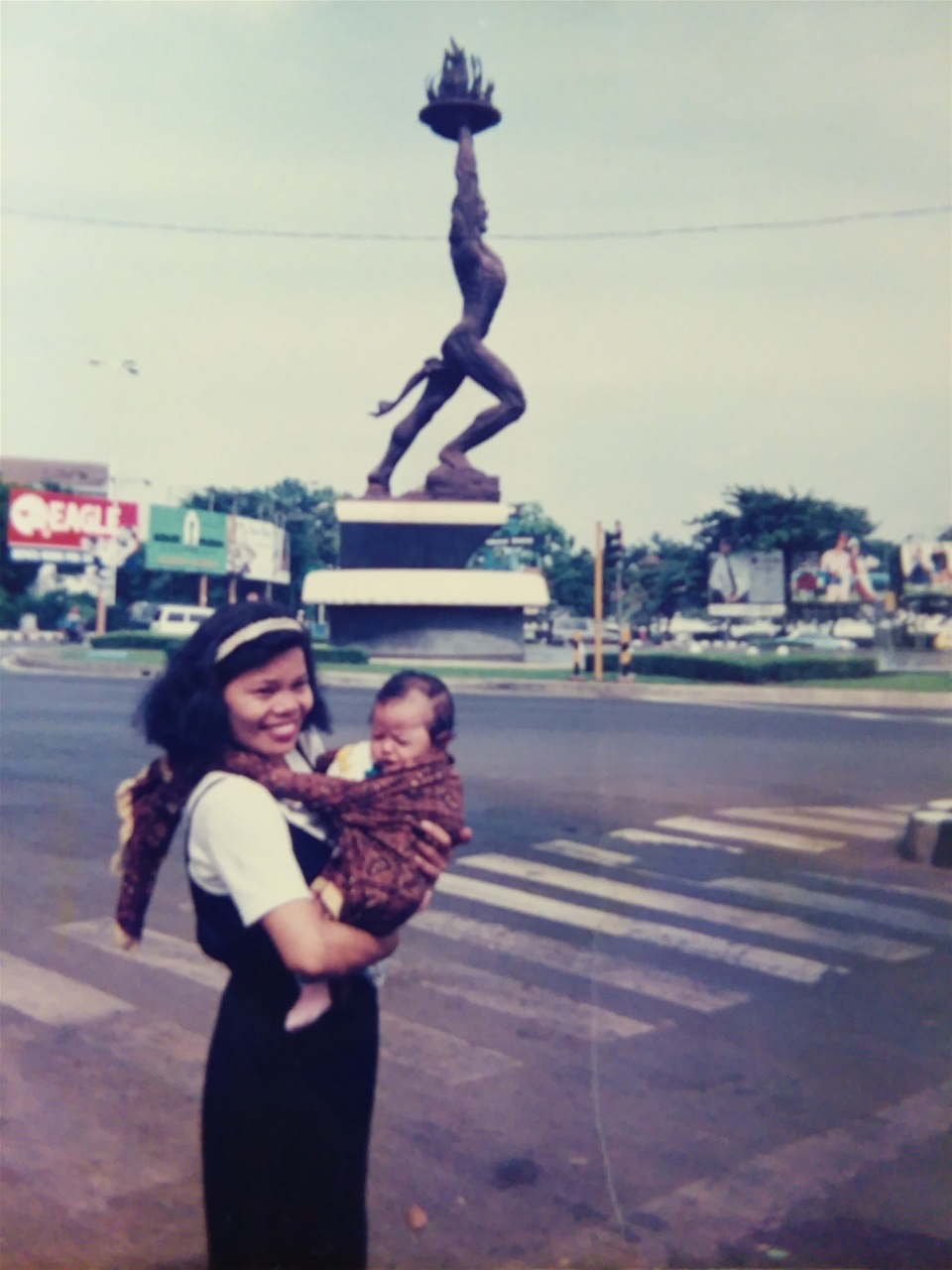 FARIDA IS HOLDING 3 MONTH OLD RAYHEND IN JAKARTA.