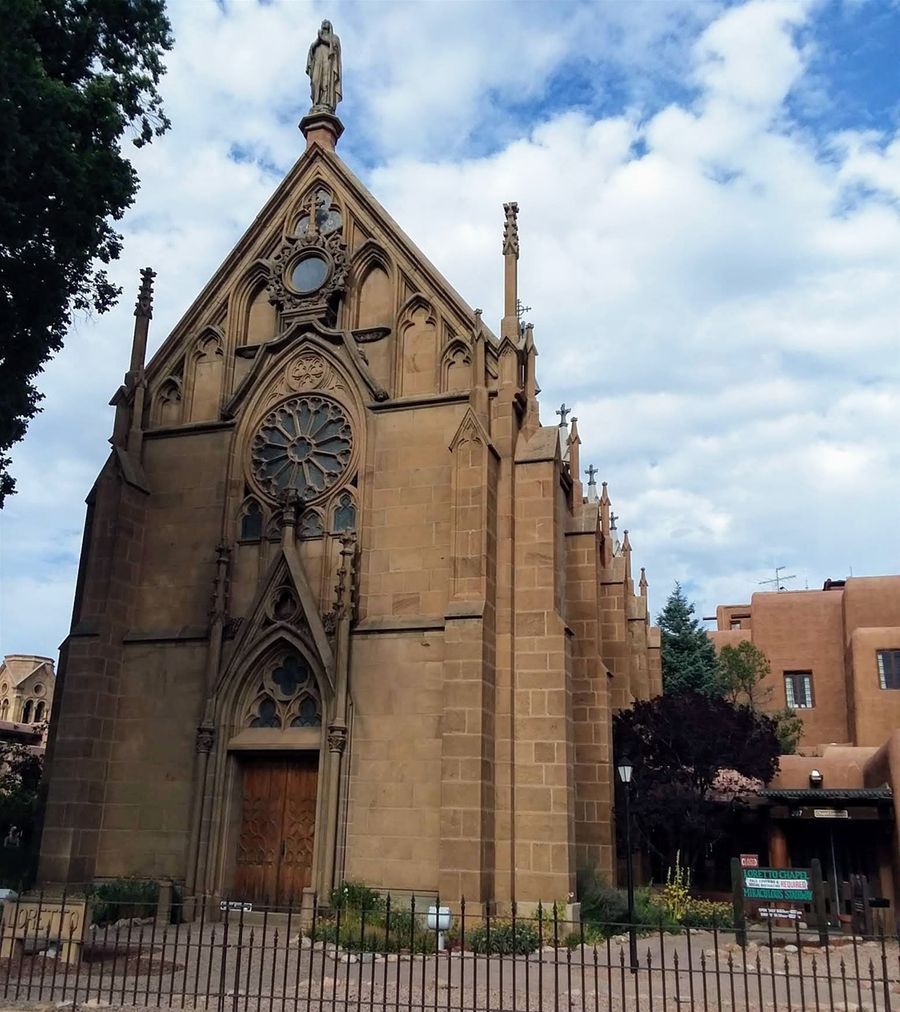 This is Loretto Chapel at 207 Old Santa Fe Trail, Santa Fe New Mexico. Construction began in 1873. The six sisters of Loretto, who were sent to Santa Fe to start up a school for girls had commissioned the construction. There is a 