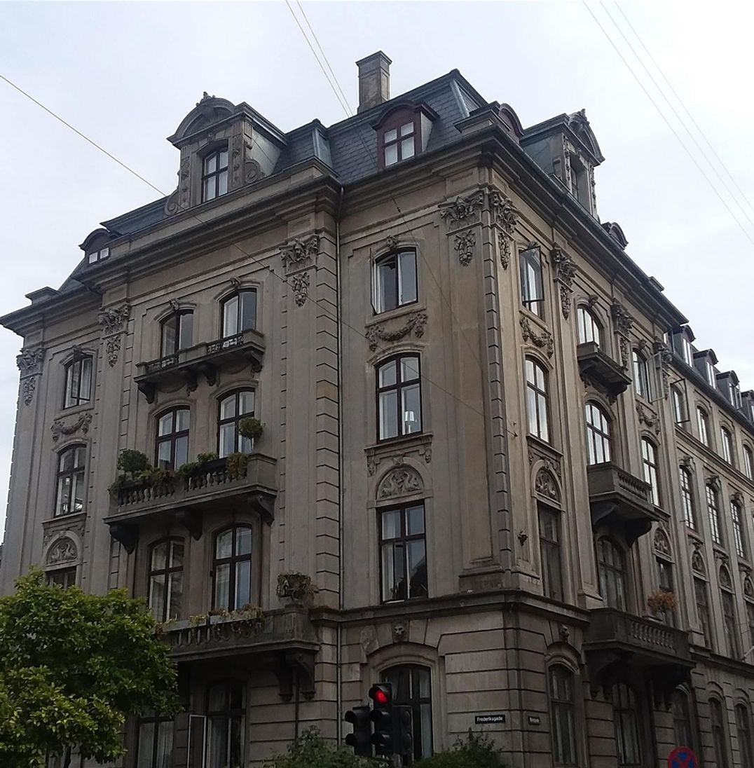 This building is only a few yards from Fredriks' Church in Copenhagen. I do not know what it is but it might be an office building because there is a Laser Hair Removal Clinic located here. I am standing at the intersection of Bredgade and Fredriksgade. Fredriks' Church is at the left of this photo and Amalienborg Palace is to the right. The gold domes behind this building are on top of the Saint Alexander Nevsky Russian Orthodox Church. I photographed this building only because I like it..