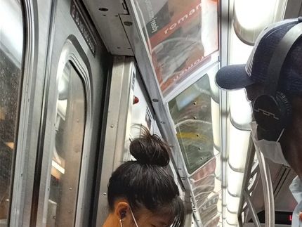 On the subway line E from Jackson Heights subway station to 34th stop near Penn Station.