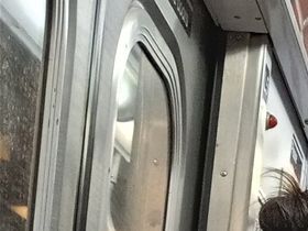 On the E line of the NYC subway from Jackson Heights to Penn Station of Manhattan. We had to take the Q 70 bus from La Guardia Airport to Jackson Heights subway station to get on this car.