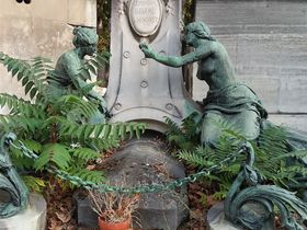 This grave site can be seen near one of the entrances of Père Lachaise cemetery in Paris.