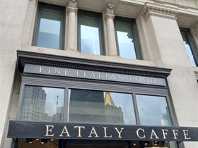 And here is the entrance to Eataly Flatiron District. The sign calls it a cafe but it is much more than that. Inside these doors are several cafes and delis making for good sized Italian bazaar.