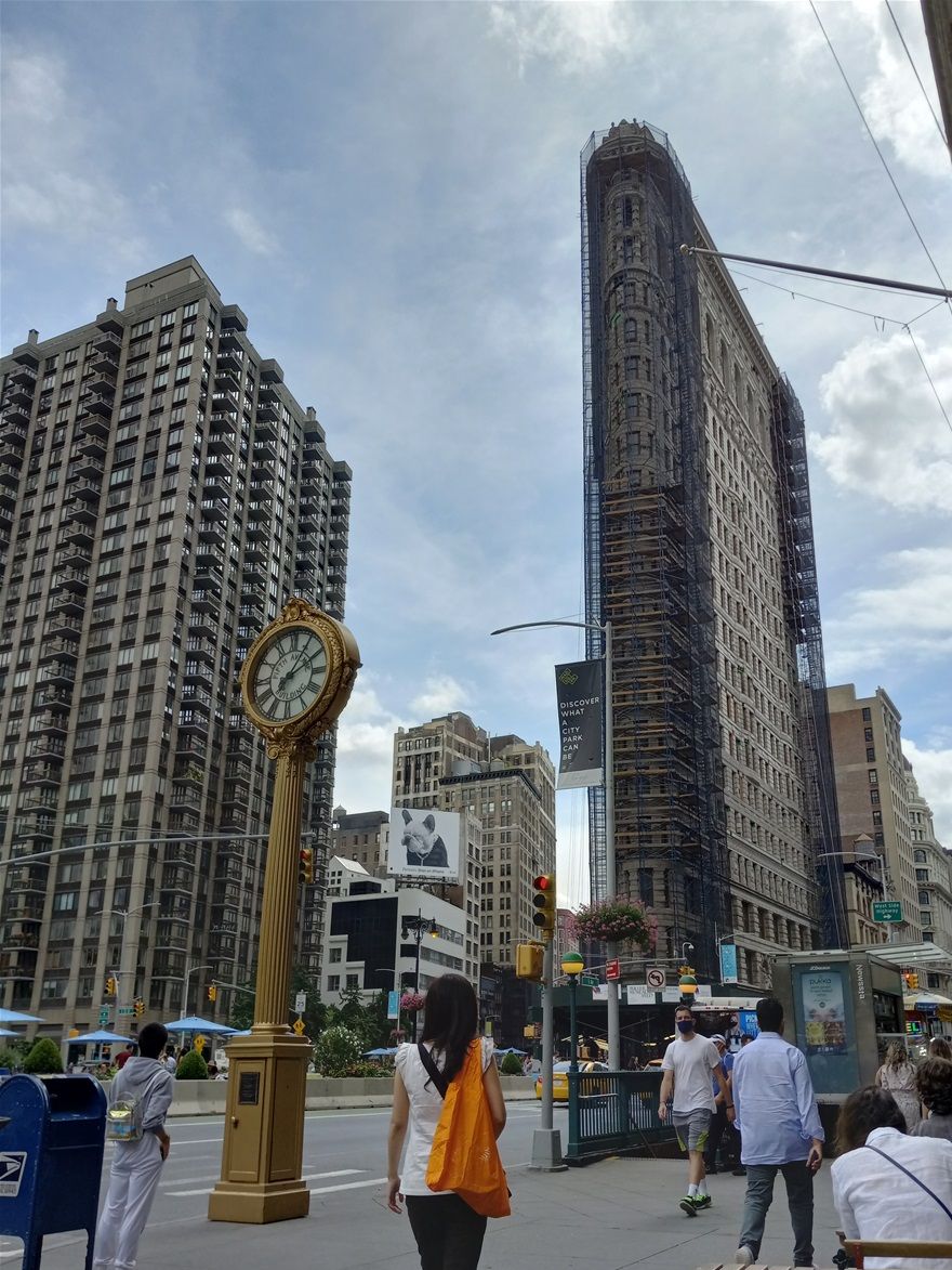 The Flatiron Building is one of the most iconic buildings in Manhatten. It is in mid Manhatten surrounded by 5th Avenue, Broadway, and 22nd Street. I was in front of the Eataly Italian Market and Café when I took this photo.