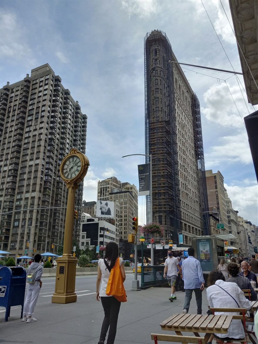 The Flatiron Building is one of the most iconic buildings in Manhatten. It is in mid Manhatten surrounded by 5th Avenue, Broadway, and 22nd Street. I was in front of the Eataly Italian Market and Café when I took this photo.