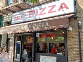 Close to Washington Square is this branch  of Joes' Pizza. There are 4 or 5 locations in NYC. I had the pizza at the Fulton Street and at the Carmine Street locations. This branch is smaller than the one on Fulton Street. Joes' Pizza is quite famous in NYC. Both of these locations have photos of well known people who have frequented Joes' Pizza. Some well known people who have eaten at Joes' Pizza are: Matthew McConaughey, Jimmy Fallon, Anne Hathaway, Bill Murrey, Kevin Bacon, Leonardo Di Caprio, Danny Devito, and Conan O'Brian. The location photographed here was used in the Spiderman movies as the place where Peter Parker worked when he was delivering pizzas. During the filming of Spiderman movies, this branch was located at 233 Bleecker Street and recently moved here to 7 Carmine Street. This 7 Carmine Street location is 3 buildings away from its original Bleecker Street location which was used in Spiderman 2. Oh, and the pizza is very good.