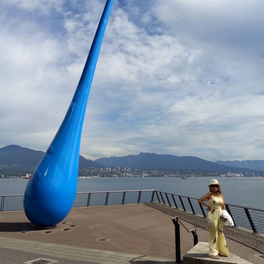 Here is Farida next to The Drop at Coal Harbor in Vancouver BC Canada.